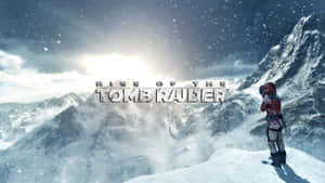 Tomb Raider角色站在雪山頂上，雪花飄落，遊戲標題可見。