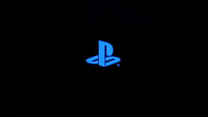 黑色背景上發光的藍色PlayStation標誌。 — 極簡美學 壁紙