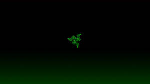發光綠色Razer標誌在黑色到深綠色漸變背景上