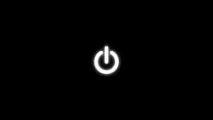 黑色背景上發光的白色電源按鈕圖示。