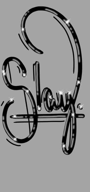 灰色背景上帶有閃閃發光亮片的粗體黑色草書「Slay」。