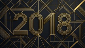 金色幾何圖案，以風格化字體顯示年份 2018，背景為深色。