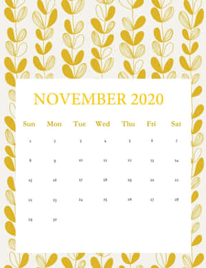 2020年11月月曆，奶油色背景上帶有金色葉片邊框。