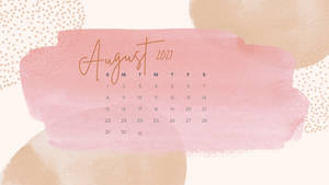 2021年8月日曆，粉紅色水彩背景和金色文字。
