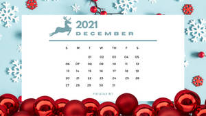 2021年12月日曆，裝飾有紅色裝飾品和白色雪花。