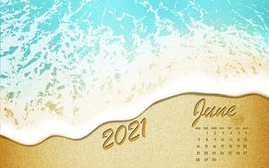 沙灘上的2021年6月月曆與綠松石色海浪。