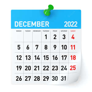2022年12月的日曆頁面，用綠色圖釘固定在白色背景上。 — 十二月 GIF 壁紙