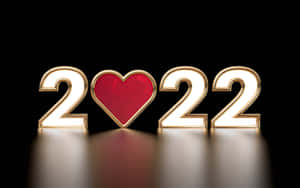金色3D數字2022，零的位置為紅色心形，在黑色表面上發光。