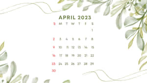 2023年4月日曆，白色背景上帶有綠色水彩葉子點綴。