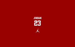 白色 Jordan 23 標誌及文字在紅色背景上