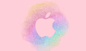 Apple 標誌搭配彩虹水彩潑濺於粉紅色背景 — iPhone 粉紅美學 壁紙