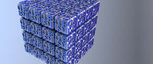 一個由藍色和銀色字母方塊組成的3D立方體，拼出cubism。