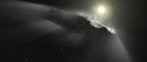 一顆巨大的小行星在深空中以明亮的太陽為背景形成剪影，可見星星。 — 銀河 壁紙