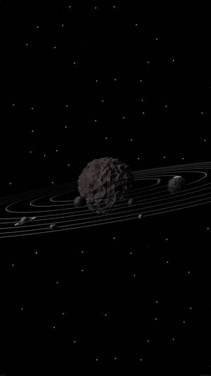 一顆帶有環的黑暗小行星在星場中運行。