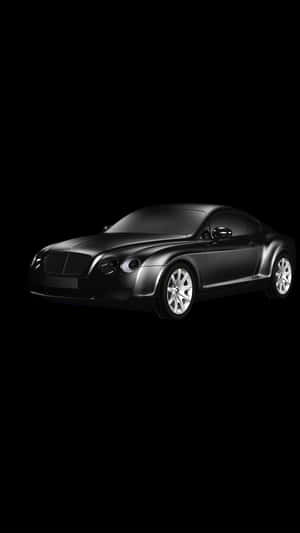 一輛黑色賓利 Continental GT 跑車孤立在黑色背景上。