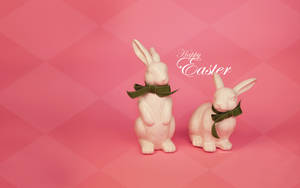 兩隻陶瓷復活節兔子繫著綠色蝴蝶結，粉紅色背景上有Happy Easter文字。
