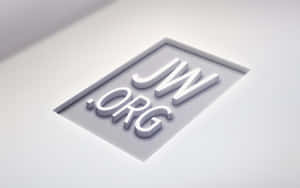 3D白色JW.ORG標誌字母嵌入灰色牆面。 — 凌志標誌 GIF 壁紙