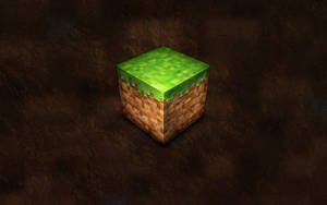 一個Minecraft草塊，帶有泥土側面，位於裂開的泥土背景上。