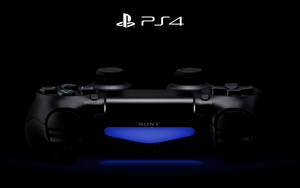 黑色PS4手掣在深色背景上發出藍光