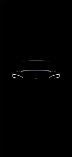 黑色背景上Tesla汽車前部輪廓帶發光車頭燈