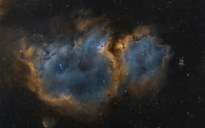 在無數星辰中閃耀的鮮豔藍色和橙色星雲。 — 星雲 壁紙