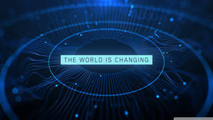 數碼電路圖案，文字 'THE WORLD IS CHANGING' 在藍色中發光。