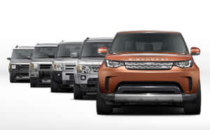 五輛 Land Rover Discovery SUV 排成一排，面向前方，在白色攝影棚背景上。 — Steam Deck OLED 壁紙