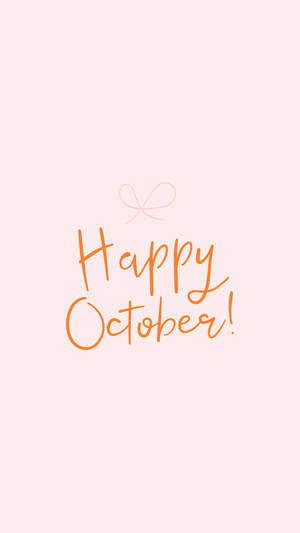 在桃色背景上用橙色草書寫的 Happy October 訊息，附有一個小蝴蝶結。