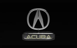 Acura汽車品牌標誌，鍍鉻飾面，金色字體，黑色背景。