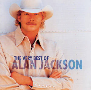 Alan Jackson 戴白色牛仔帽和穿白色襯衫，雙手交叉在專輯封面上。 — 拉馬爾·傑克遜 壁紙