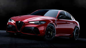 紅色 Alfa Romeo 轎車，帶黑色飾邊和發光車頭燈，背景黑暗。