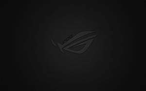 帶有紋理的黑色背景上的深色 ROG 遊戲標誌