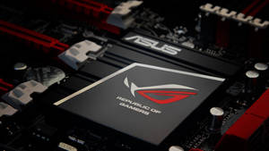 ASUS ROG 遊戲主機板特寫，帶有紅色和黑色組件。