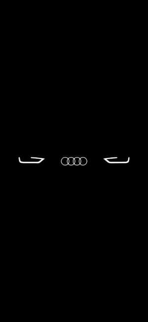 黑暗中發光的 Audi 汽車標誌和頭燈。 — HMD Aura 2 壁紙