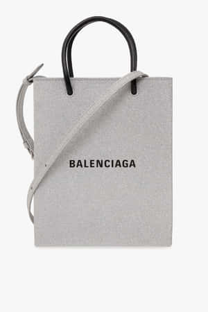 灰色Balenciaga手提袋，配有黑色手柄和肩帶。