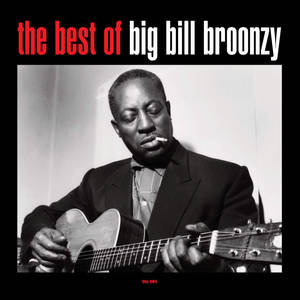 爵士結他手 Big Bill Broonzy 口中叼著香煙彈奏結他。