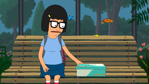 來自 Bob's Burgers 的 Louise 坐在長椅上，手持一個標有 Jeff 的鞋盒，周圍有蝴蝶。