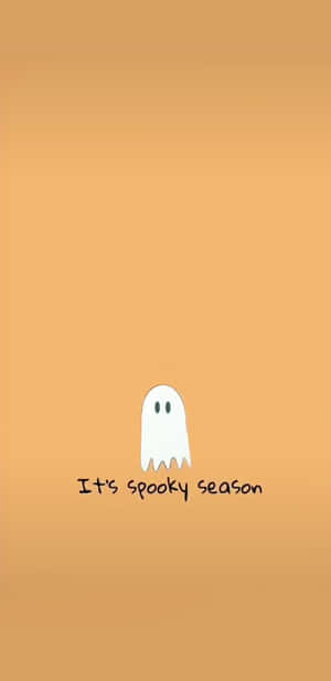 一個白色卡通鬼魂，有兩隻眼睛，在橙色背景上，文字為spooky season。