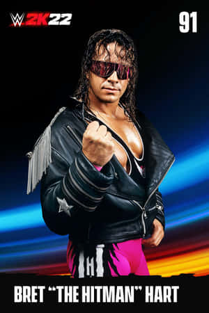 摔角手 Bret Hart 身穿皮褸和粉紅色褲，舉起拳頭擺姿勢。