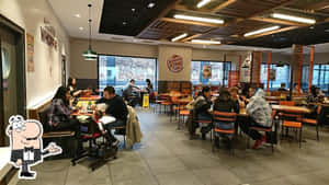 人們在漢堡王用餐，窗外可見積雪。