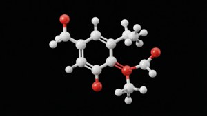 一個3D分子模型，白色和紅色的球體在黑色背景上