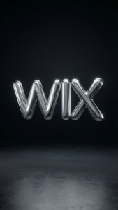鉻色WIX標誌漂浮在黑暗空間中，帶有地板反射