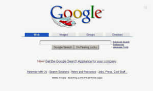 2002 年 Google 搜索引擎首頁，帶有火箭標誌和搜索欄。