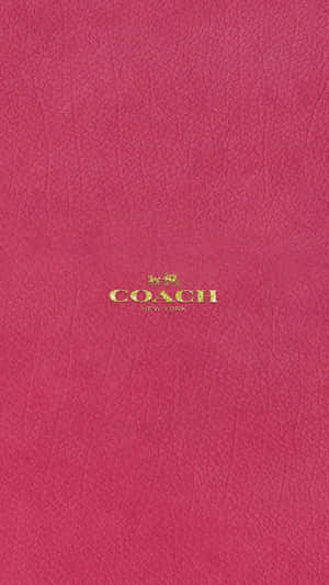 粉紅色皮革 Coach 銀包，金色標誌