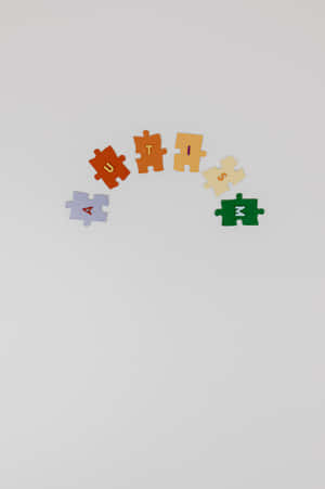 拼圖塊在白色背景上以曲線拼出自閉症 — POCO Pad 壁紙