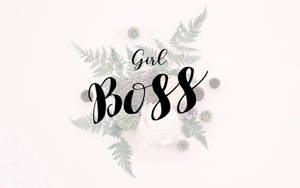 優雅的花卉佈置，白色背景上以黑色字體寫有「Girl Boss」文字。