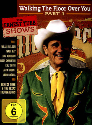 Ernest Tubb 戴著牛仔帽、穿著綠色西裝在專輯封面上微笑。