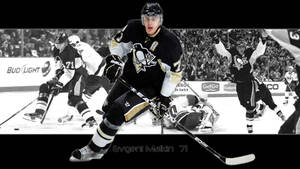 冰球運動員 Evgeni Malkin 在比賽中慶祝入球。