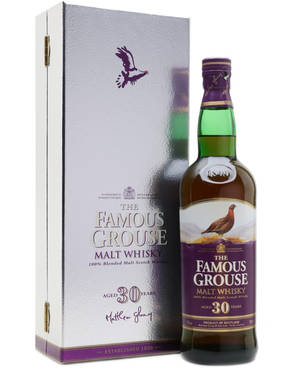 一瓶30年陳釀的Famous Grouse威士忌及其銀色禮盒。