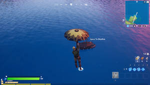 Fortnite 玩家帶住雨傘同小船喺海洋上空滑翔